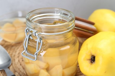 Photo of Delicious quince drink and fresh fruits on table, closeup