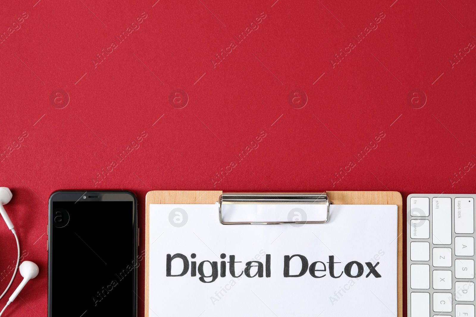 Photo of Flat lay composition with clipboard and words DIGITAL DETOX on red background. Space for text