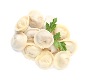 Pile of boiled dumplings with parsley leaves on white background, top view