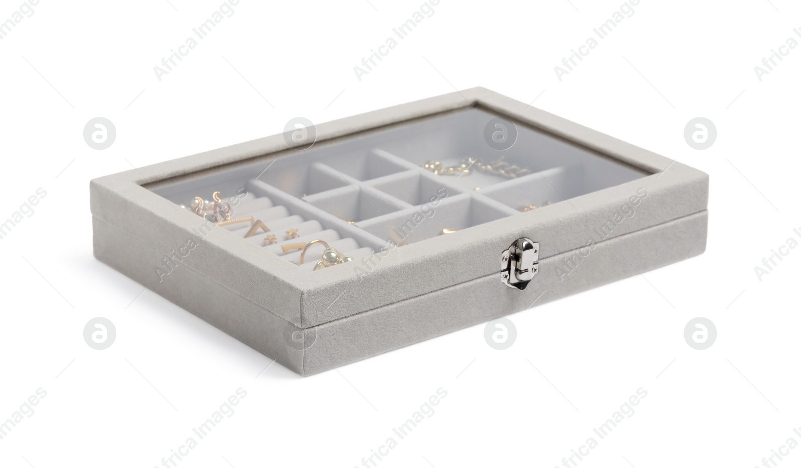 Photo of Jewelry box with many different golden accessories isolated on white