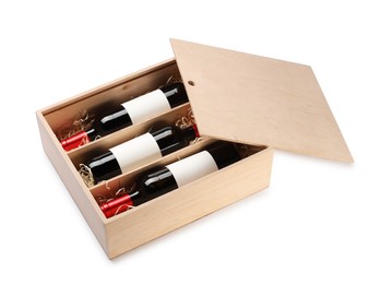 Photo of Wooden gift box with wine bottles isolated on white