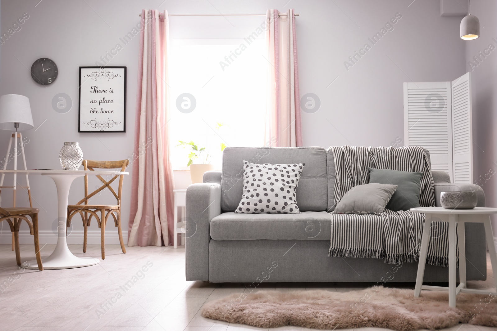 Photo of Stylish living room interior with comfortable couch