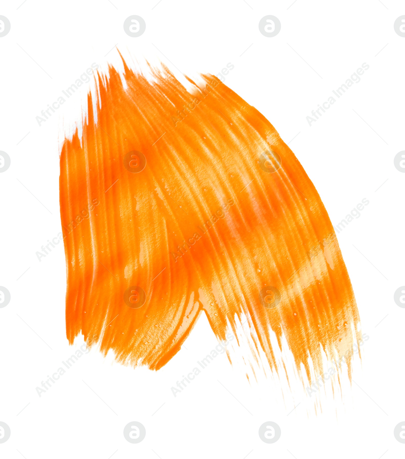 Photo of Abstract brushstroke of orange paint isolated on white