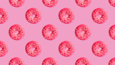 Image of Creative pattern design of glazed donuts on pink background, banner