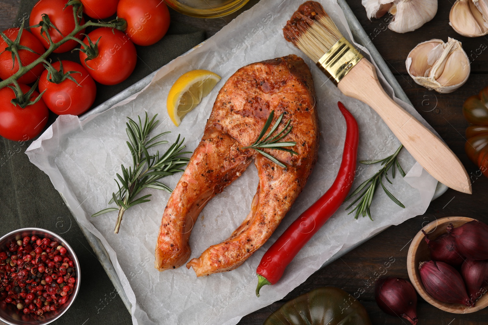 Photo of Fresh marinade, fish and other products on wooden table, flat lay