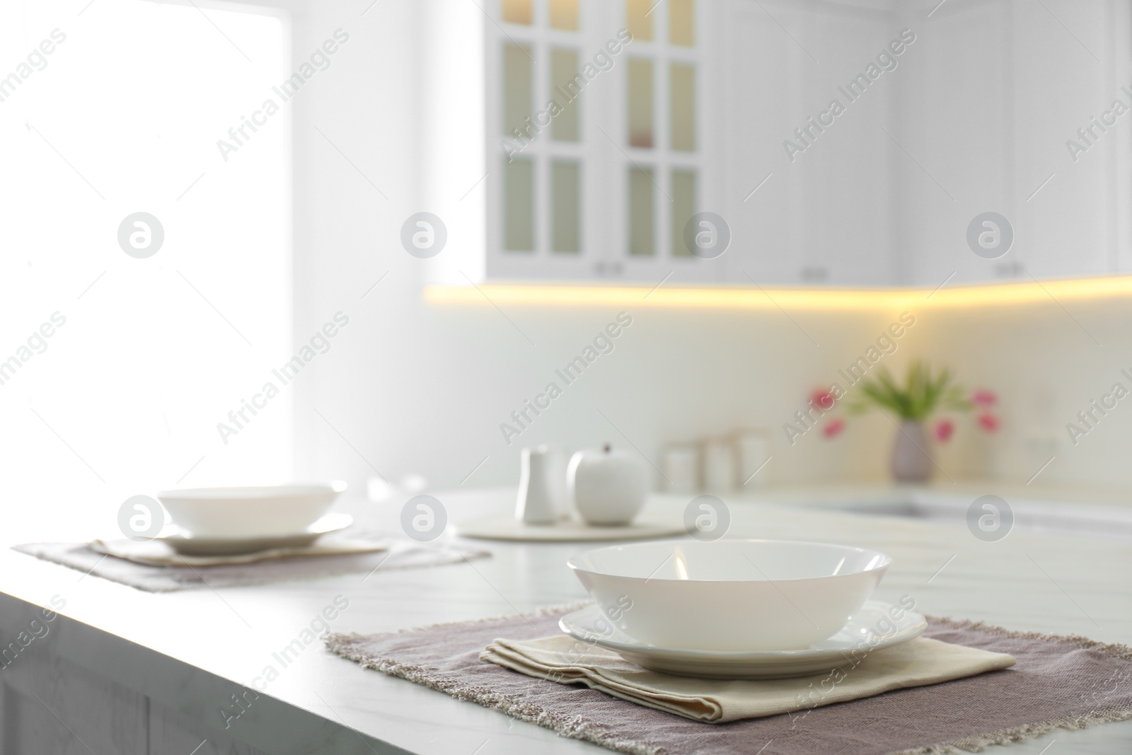 Photo of Elegant table setting on table in kitchen