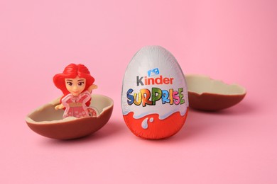 Photo of Slynchev Bryag, Bulgaria - May 25, 2023: Kinder Surprise Eggs and toy on pink background