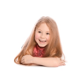 Photo of Happy little girl in casual outfit lying on white background