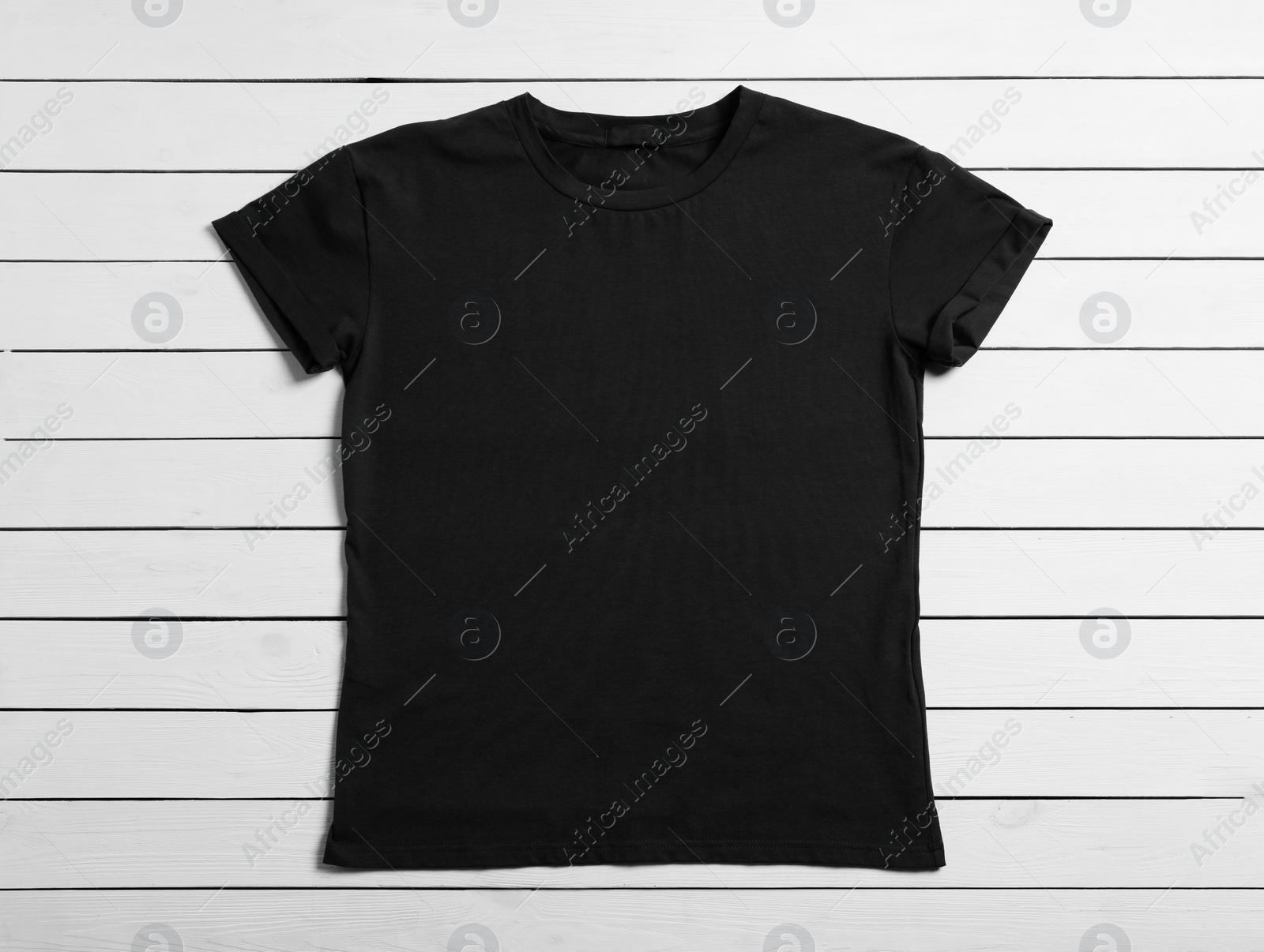 Photo of Stylish black t-shirt on white wooden background, top view