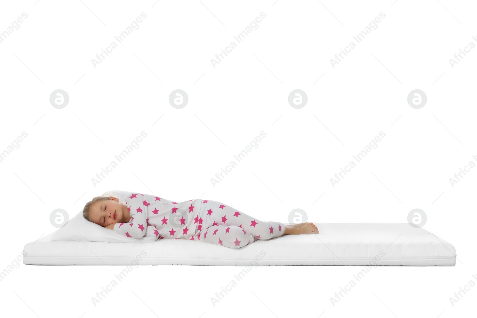 Photo of Little girl sleeping on comfortable mattress against white background