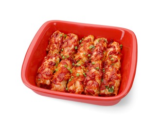 Baking dish of delicious stuffed cabbage rolls cooked with homemade tomato sauce isolated on white