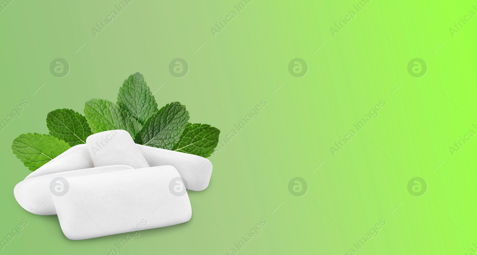 Image of Menthol chewing gum pillows and mint leaves on green gradient background, space for text