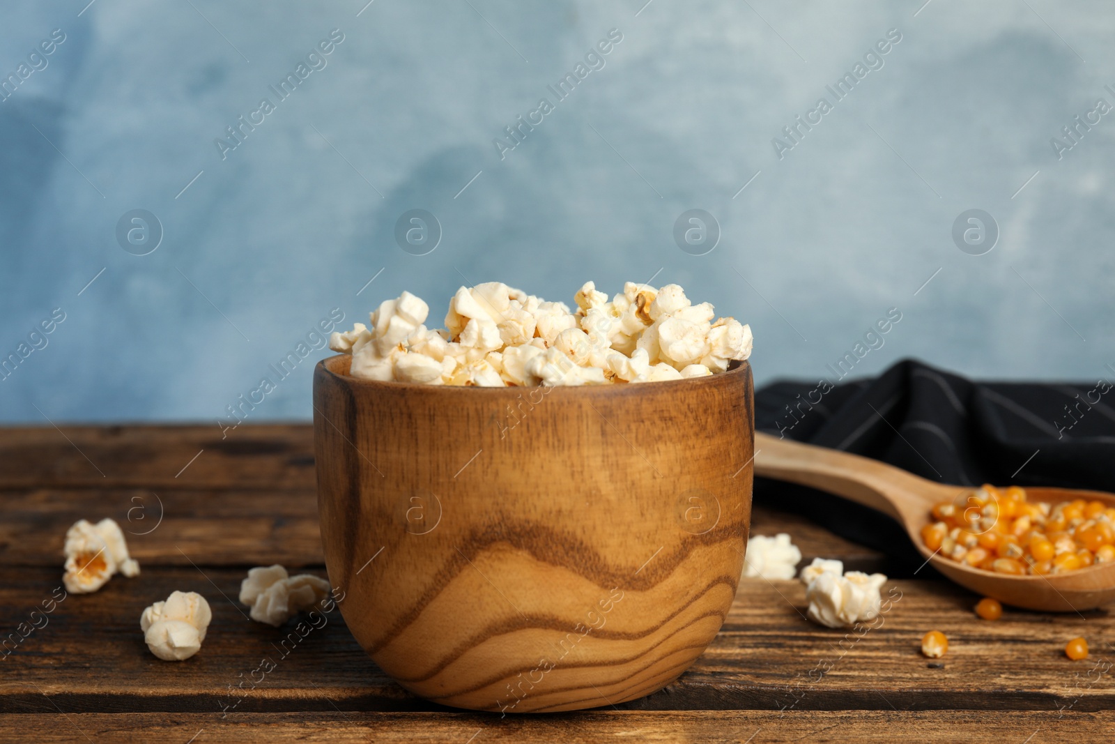 Photo of Tasty fresh pop corn on wooden table