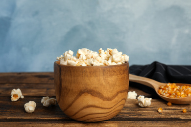 Tasty fresh pop corn on wooden table