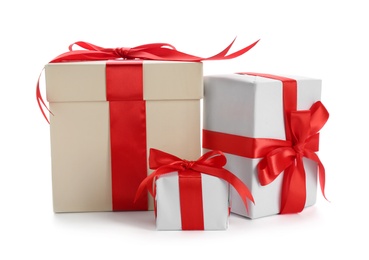 Photo of Beautifully decorated gift boxes on white background