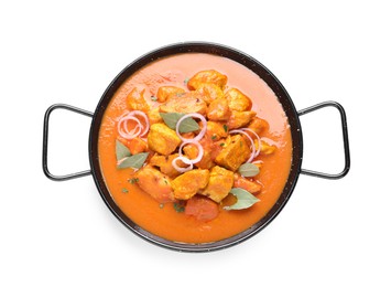 Photo of Delicious chicken curry in pan on white background, top view