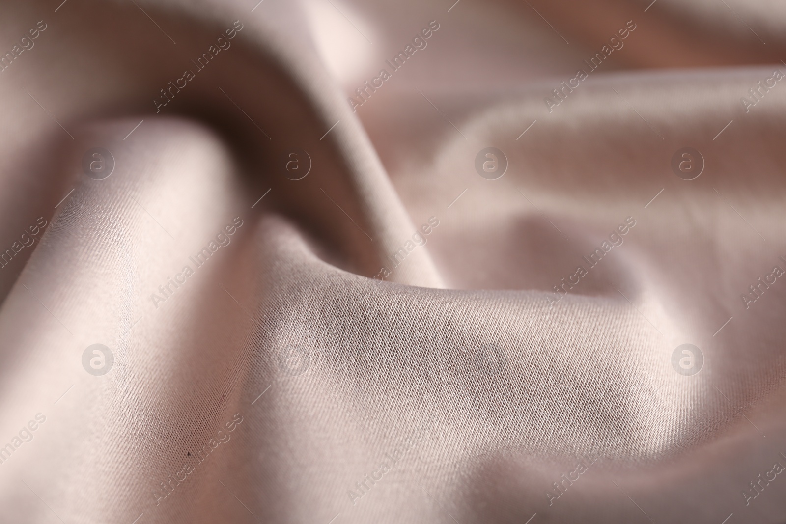 Photo of Texture of delicate pink fabric as background, closeup