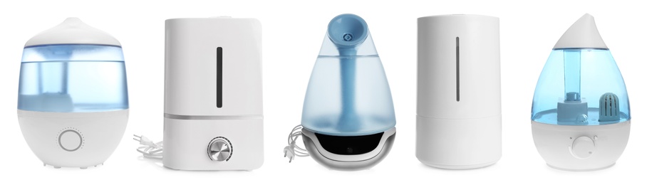 Image of Set of modern air humidifiers on white background