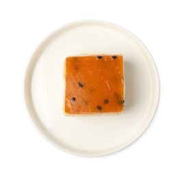 Piece of cheesecake with jelly on white background, top view