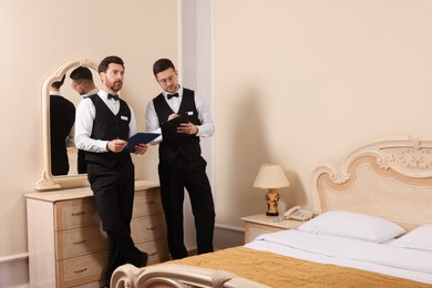 Photo of Men attending professional butler courses in hotel
