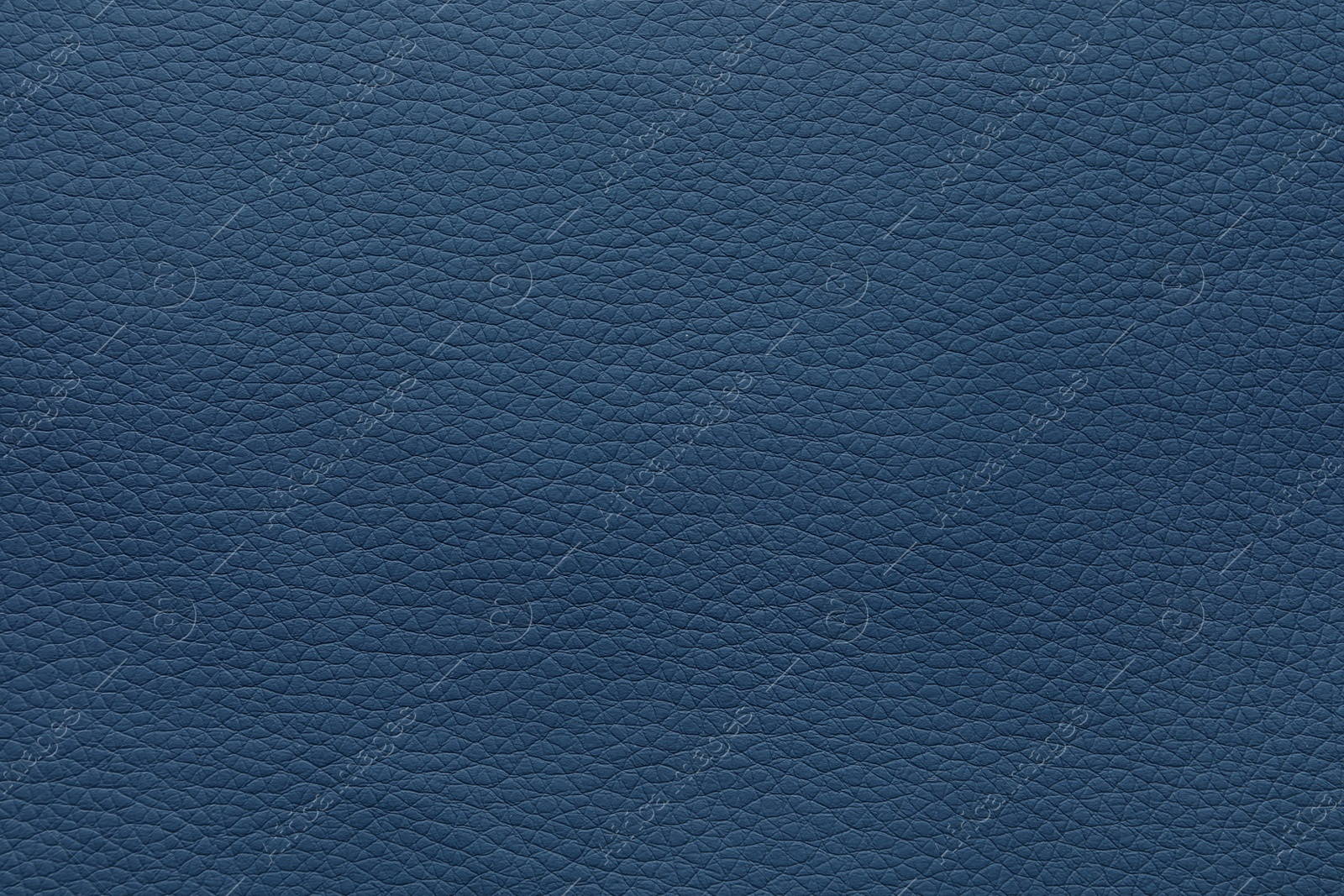 Photo of Texture of blue leather as background, closeup