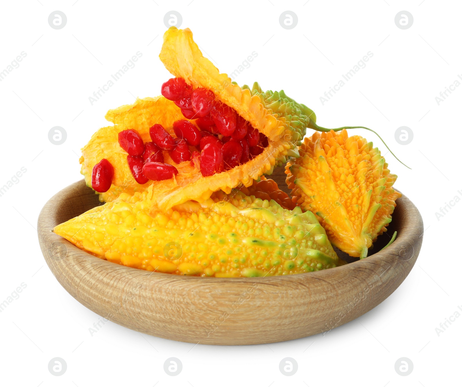 Photo of Wooden bowl with fresh ripe bitter melons on white background