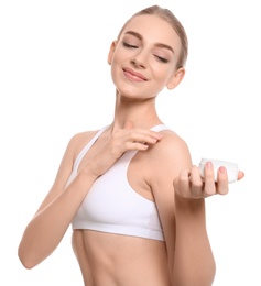 Young woman with jar of body cream on white background