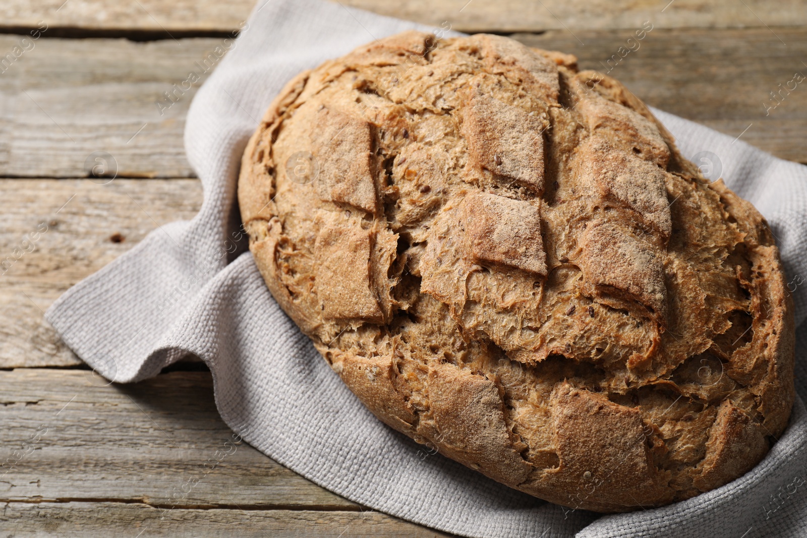 Photo of Freshly baked sourdough bread on wooden table