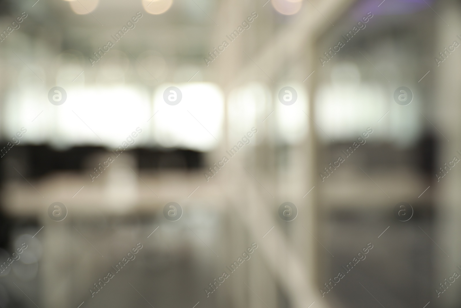 Photo of Blurred view of cozy workspaces with tables and chairs in office