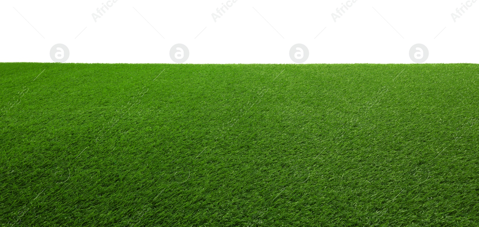 Photo of Green artificial grass surface isolated on white