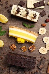 Photo of Flat lay composition with different tasty cakes on wooden table