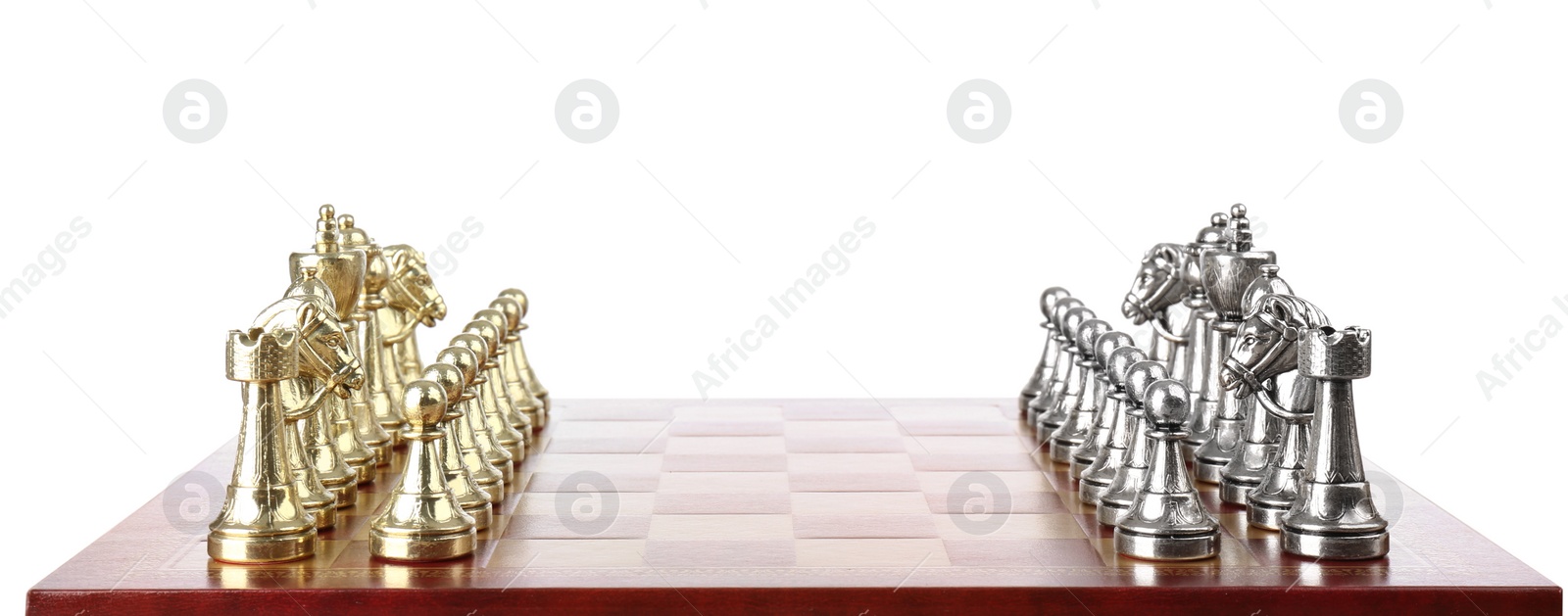 Photo of Chess pieces on wooden board against white background