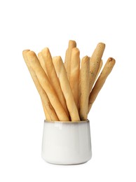 Delicious grissini sticks in cup on white background