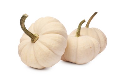 Photo of Three ripe beige pumpkins isolated on white