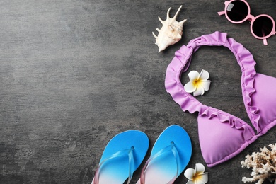 Flat lay composition with beach objects on wooden background