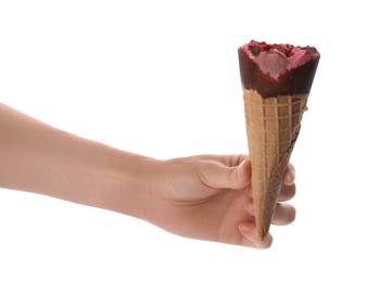 Photo of Woman holding delicious ice cream in waffle cone on white background, closeup