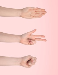 Image of People playing rock, paper and scissors on pink background, closeup