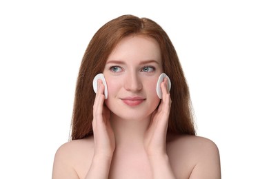 Photo of Beautiful woman with freckles wiping face on white background