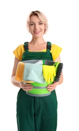 Female janitor with cleaning supplies on white background