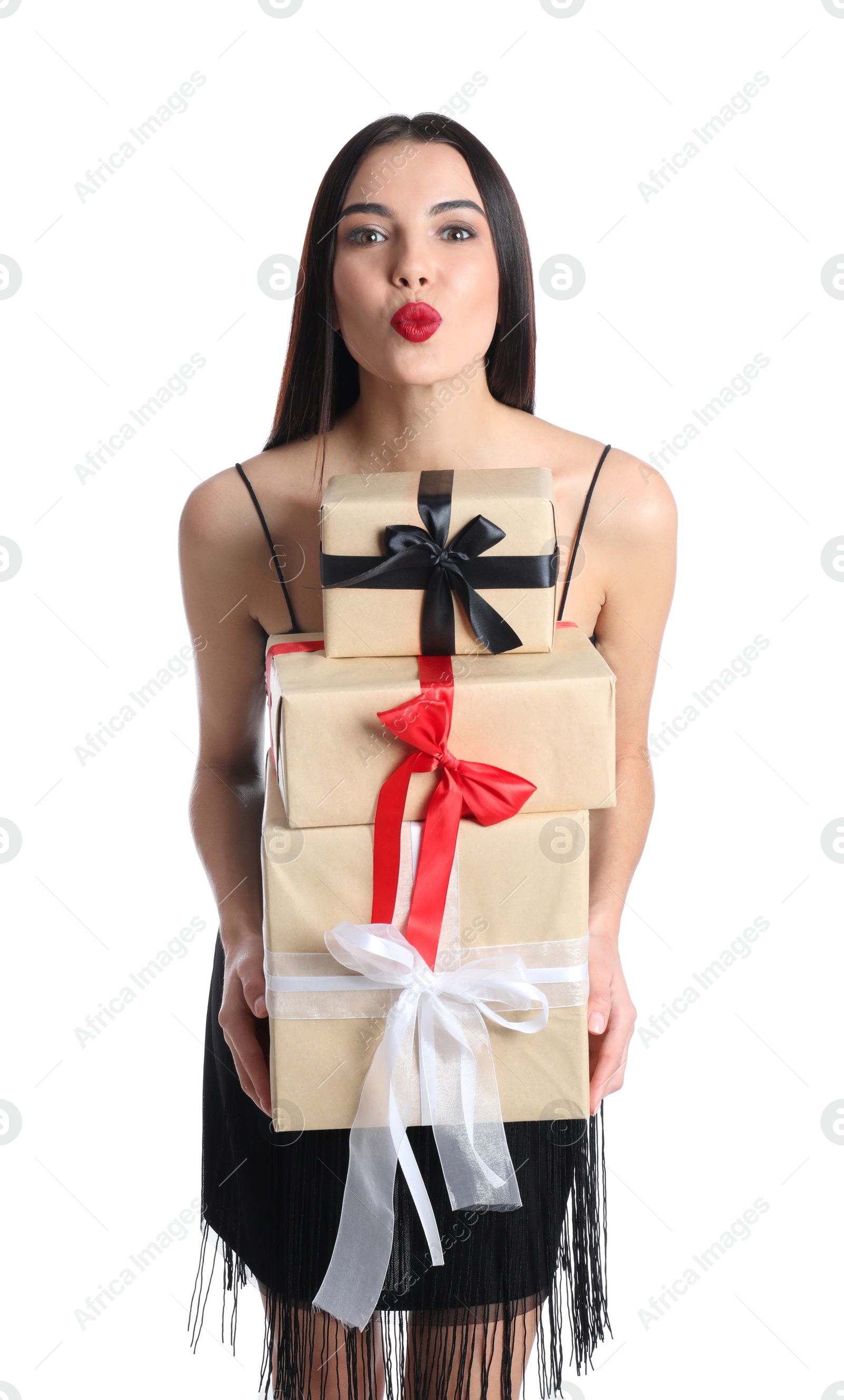 Photo of Woman in party dress holding Christmas gifts on white background