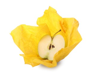 Photo of Half of apple in yellow beeswax food wrap on white background