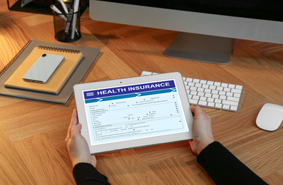 Image of Woman with modern tablet indoors, closeup. Health insurance