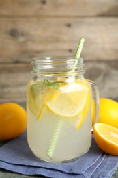 Cool freshly made lemonade in mason jar on table