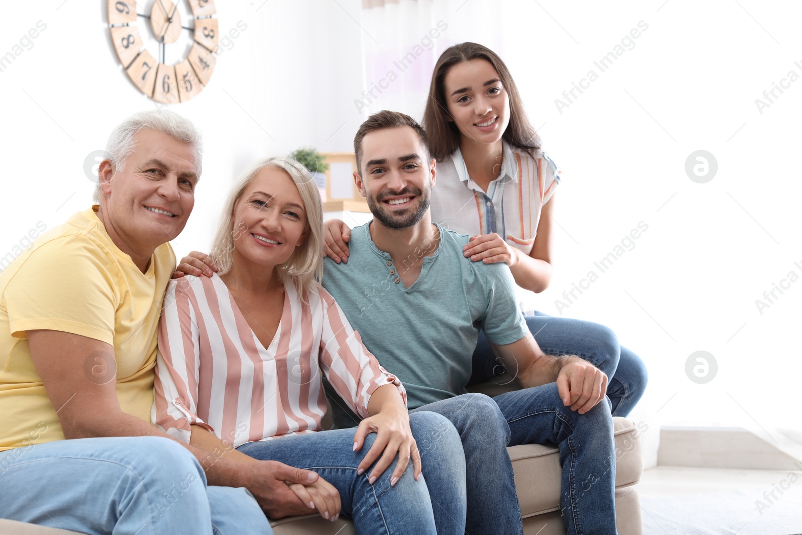 Photo of Portrait of happy family at home. Space for text