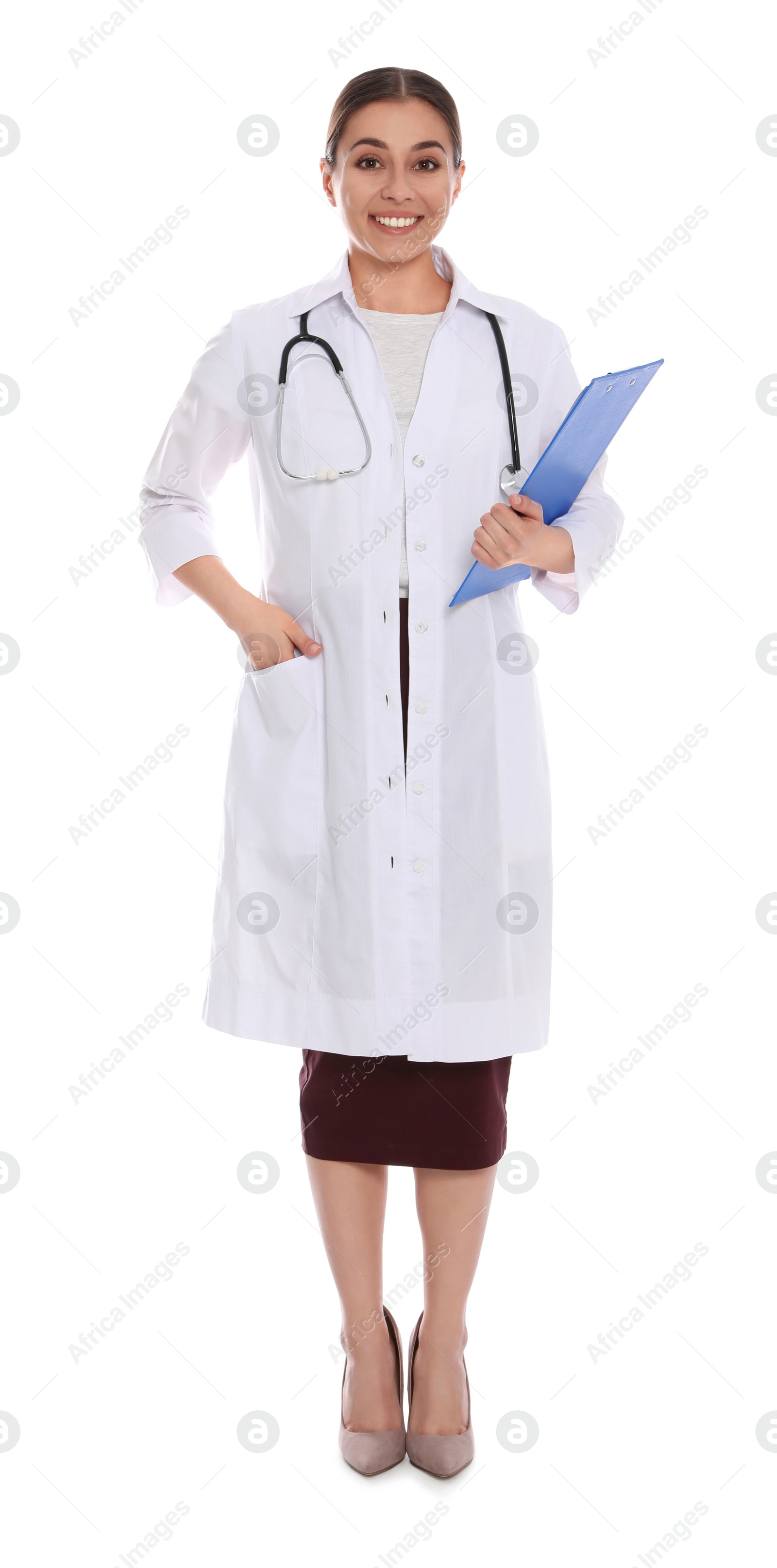 Photo of Full length portrait of medical doctor with clipboard and stethoscope isolated on white