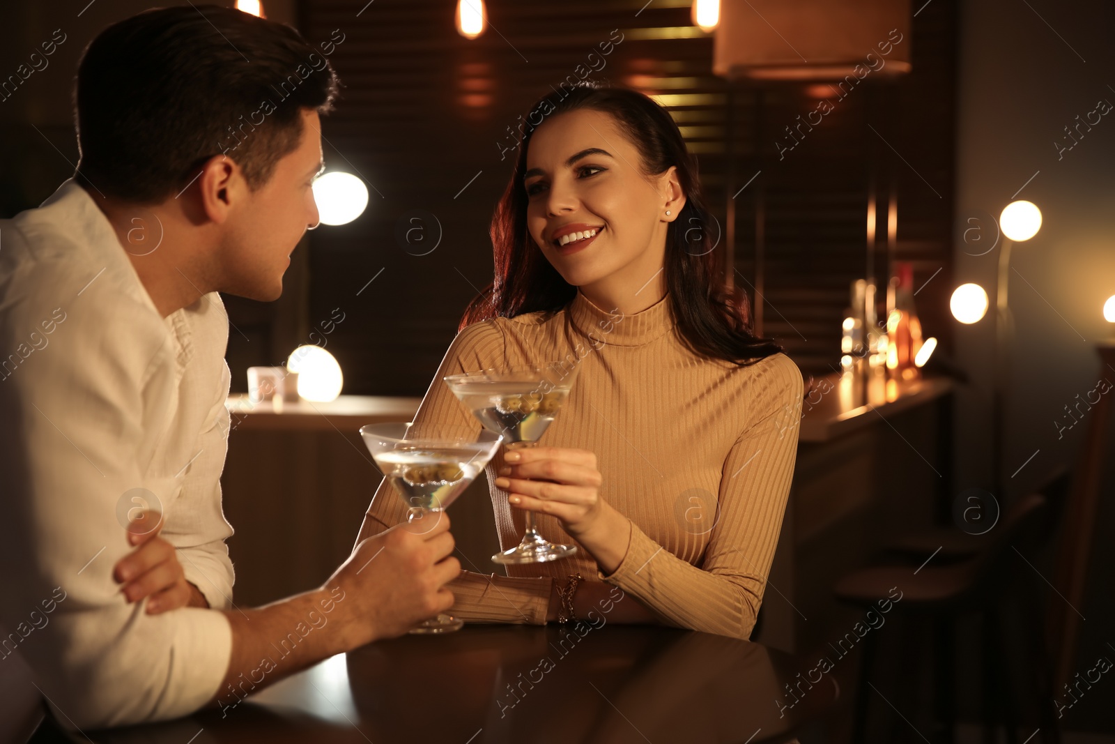 Photo of Man and woman flirting with each other in bar