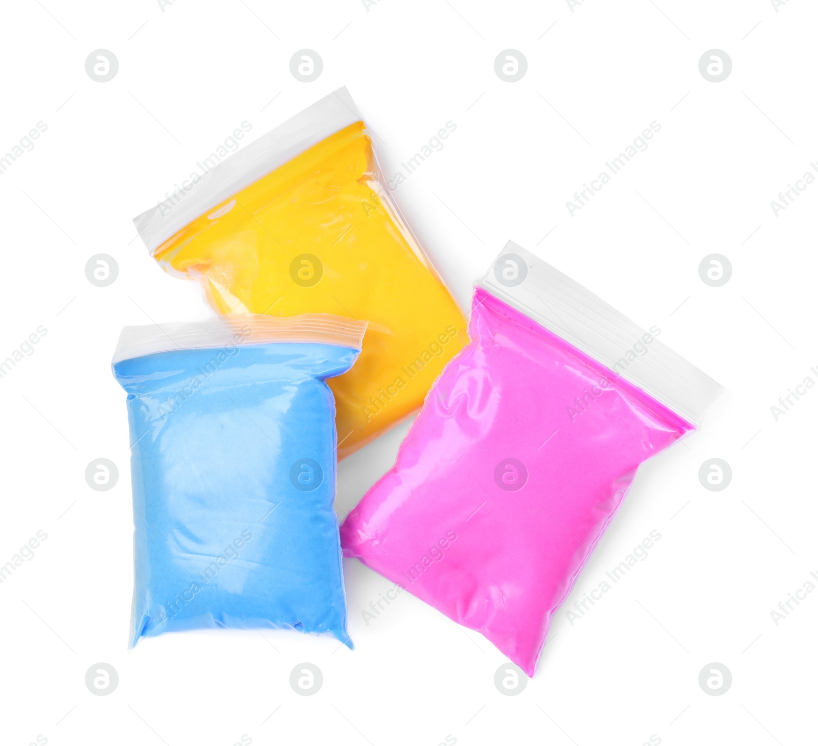 Photo of Packages of different colorful plasticine on white background, top view