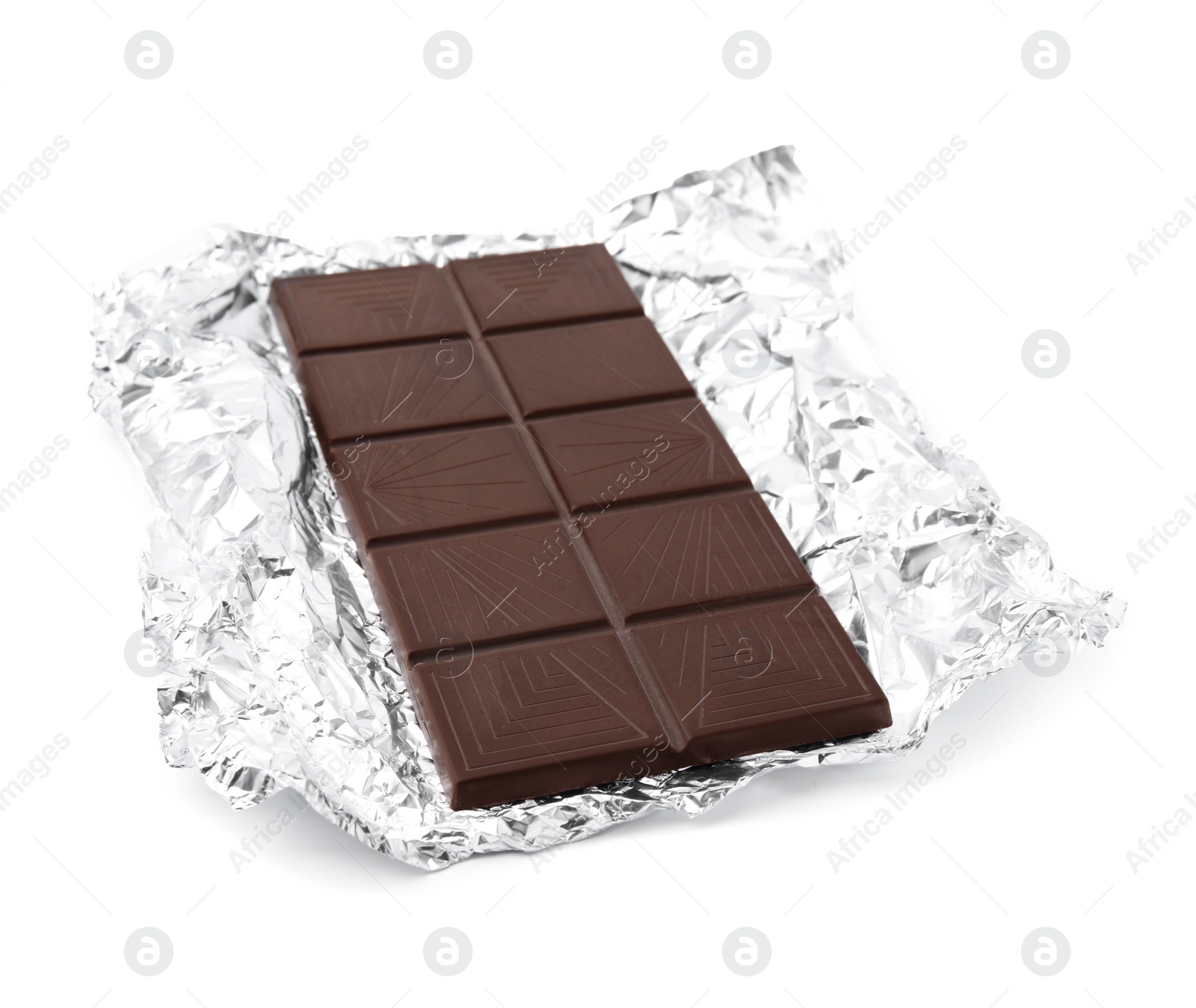 Photo of Delicious dark chocolate bar with foil isolated on white