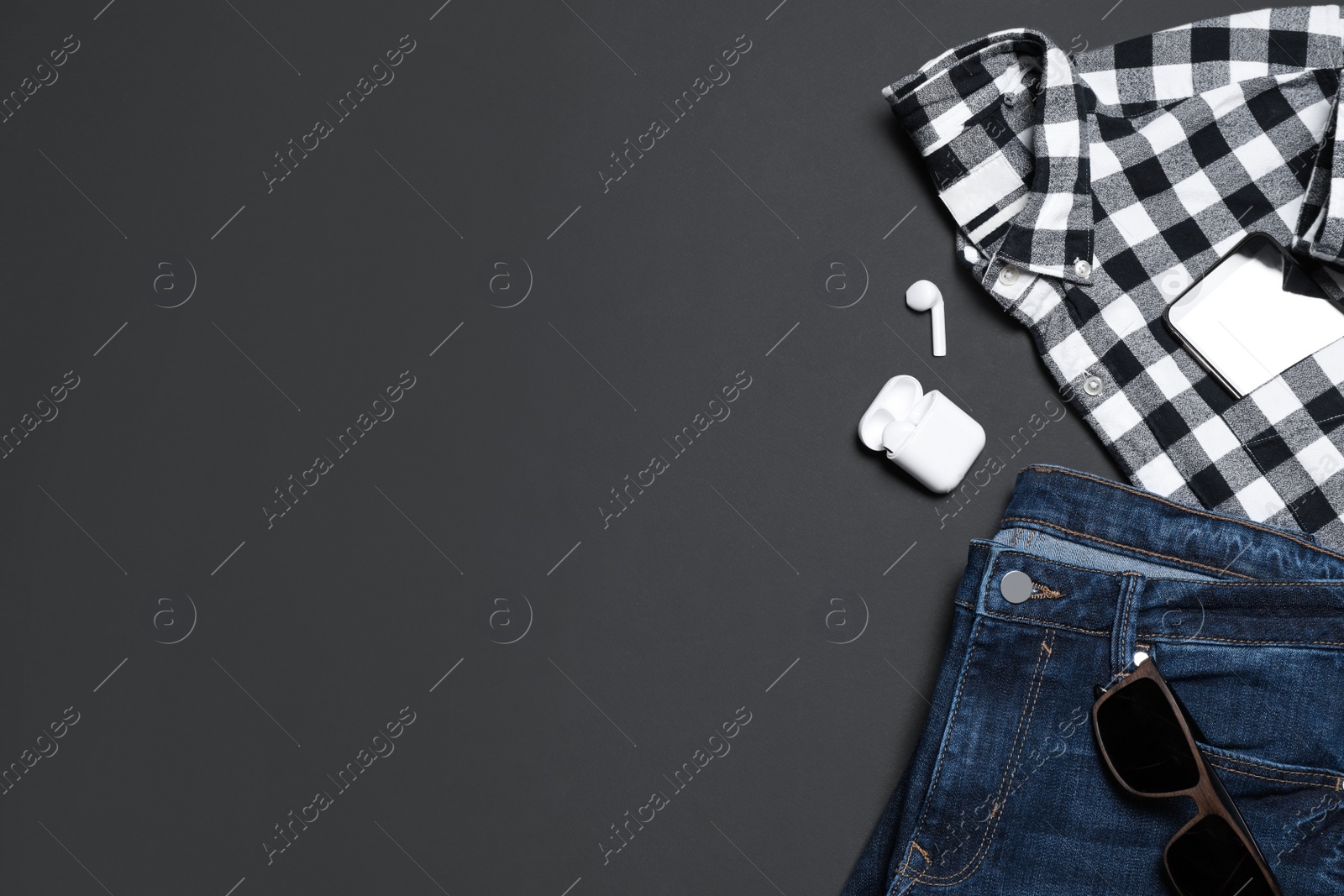 Photo of Flat lay composition with stylish men's clothes and accessories on black background, space for text