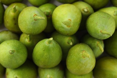 Photo of Many fresh green figs as background, top view